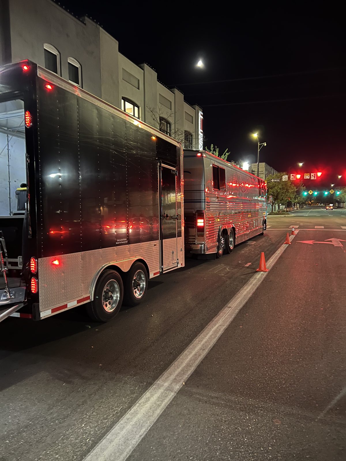 Coach and trailer parked at night